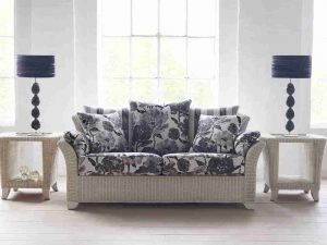 Vibrant cane furniture with flowery fabrics