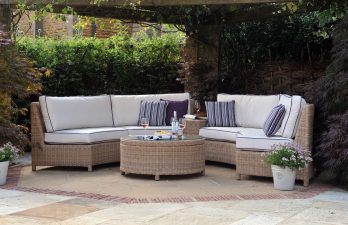 natural rounded cane furniture suite situated on a patio