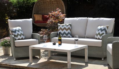 grey outdoor cane furniture suite on a patio