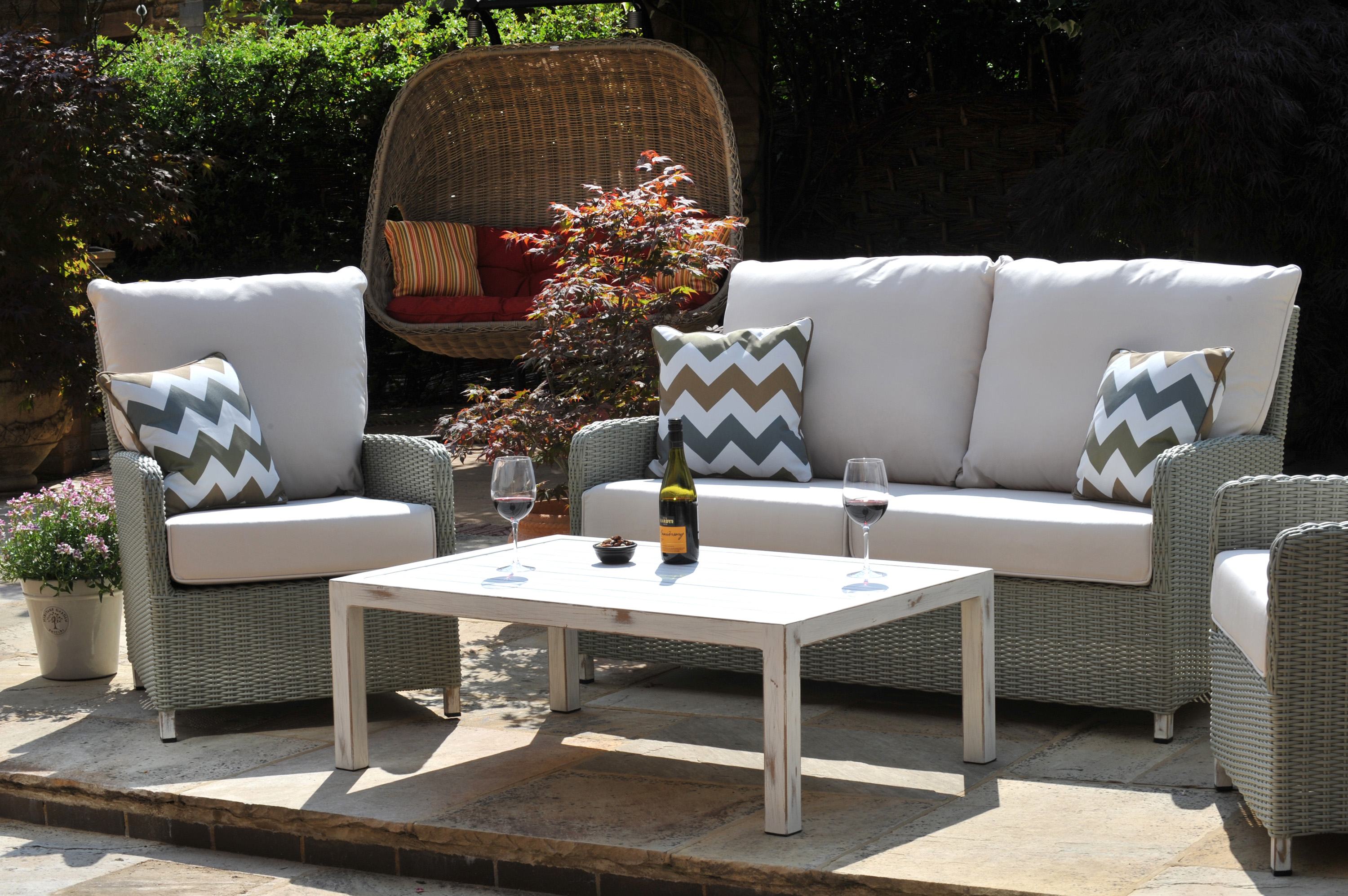 grey outdoor cane furniture suite on a patio